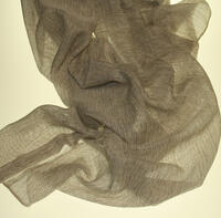 Inbetween Leipzig heeft een grovere en stoere weefstructuur met creme en donkerbruine garens