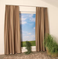 Overgordijn Grinon is een verduisterende weefstof die een warme sfeer in je interieur brengt